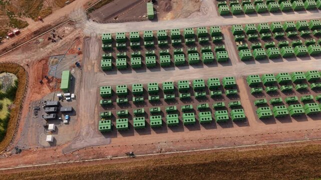 Aerial view of containerised battery energy storage systems BESS with liquid cooled lithium iron phosphate cells