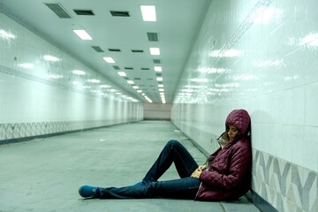 Lonely person in urban tunnel. © Rawpixel.com