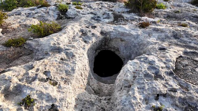 Xemxija, Malta 29.07.2026 - Xemxija Heritage trail, Neolithic tombs dug into the coralline limestone.