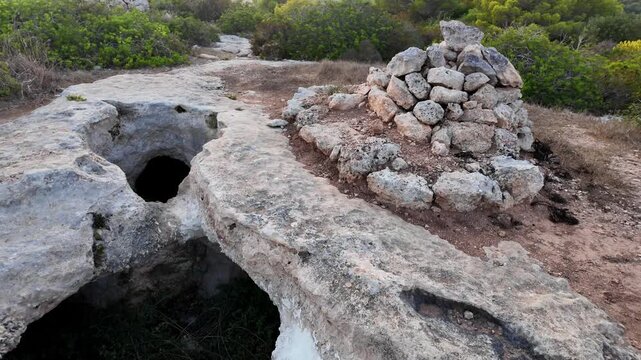 Xemxija, Malta 29.07.2026 - Xemxija Heritage trail, Neolithic tombs dug into the coralline limestone.
