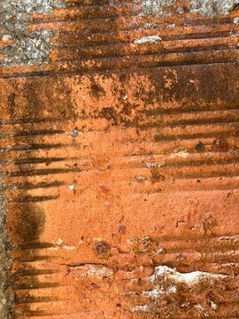 Weathered Red Clay Brick Texture with Horizontal Grooves and Aged White Mold and Grunge Surface