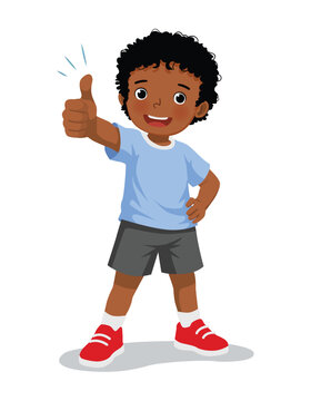 Little African boy showing thumb up gesture
