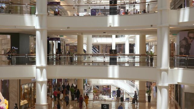 sunny day illuminated kuala lumpur city famous central modern mall crowded hall slow motion walking panorama 4k malaysia