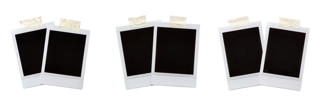 Arrangement of three pairs of instant photo frames with tape against black background