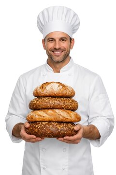 Smiling baker holding assorted bread.