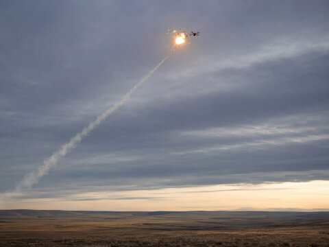Air Defense Missile Intercepting Drone in Cloudy Sky