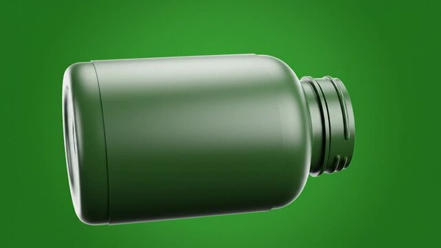 Rotating top down shot of an empty green pill bottle on a green background