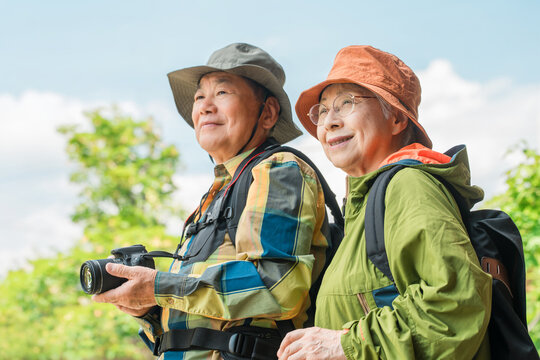Senior couple enjoying hiking and trekking (outdoors, mountaineering, leisure)