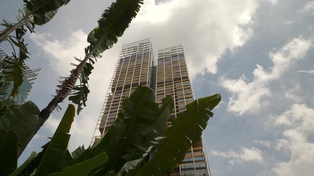 sunny day singapore city center famous modern hotel towers exterior slow motion panorama 4k 