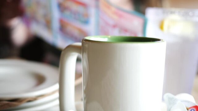 A White Porcelian Coffee Cup in Restaurant