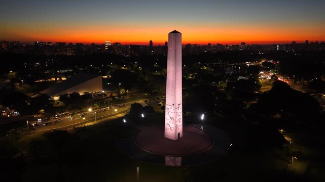 Ibirapuera Obelisk illuminated at night, in S&atilde;o Paulo, stands out as one of the most emblematic monuments in the city and pays homage to the heroes of the 1932 Constitutionalist Revolution