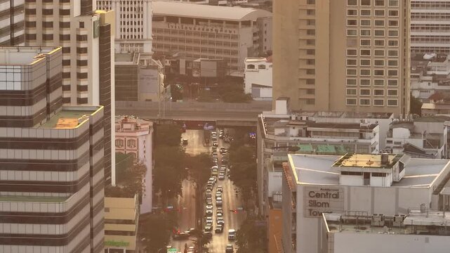 sunset time golden hour bangkok city center traffic street crossroad overpass aerial panorama 4k thailand 