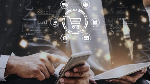 Hands interacting with mobile device and tablet while shopping online, surrounded by digital icons representing e-commerce and shopping trends. Entropy.