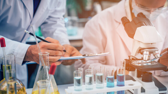 Scientist or researchers working in science laboratory, medical technology research work, science laboratory research and development concept.