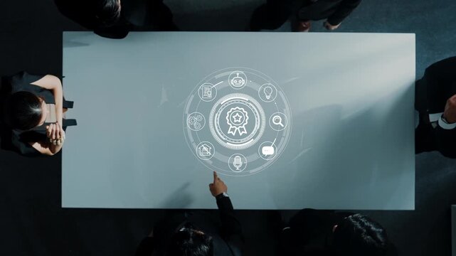 Modern Business Meeting with Digital Interactive Table Displaying Icons of Innovation, Achievement and Collaboration in a Corporate Environment. Entropy.
