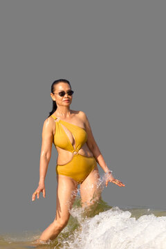 Woman in yellow swimsuit isolated