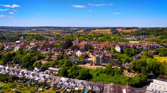 View of Rye cathedral and Ypres Tower rising above historic rooftops in East Sussex, England, in bright daylight; ideal for travel, heritage and tourism marketing