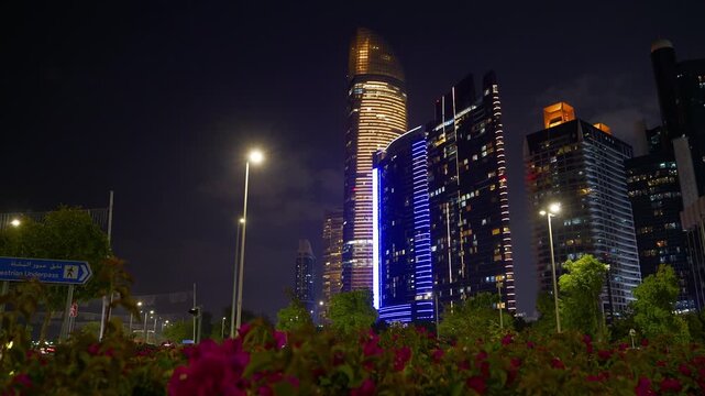 night time illumination abu dhabi city downtown front bay park flowers panorama 4k united arab emirates