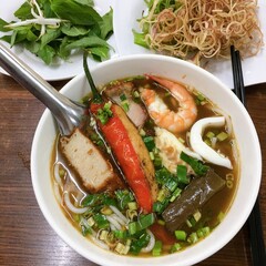 Traditional Vietnamese Bun Mam with shrimp, squid, roast pork and fish cake