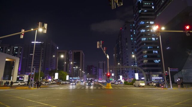night time illuminated abu dhabi city center traffic street crossroad panorama 4k united arab emirates