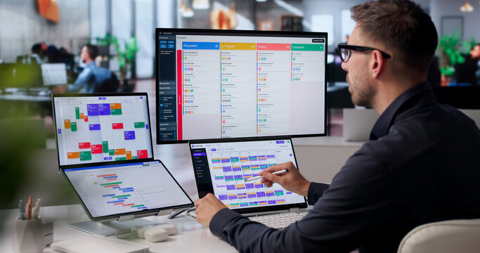Project Manager Reviews Agile Tasks