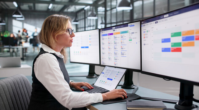 Woman Uses Laptop To Schedule Interviews