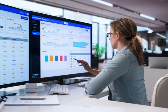 Woman Uses Computer System To Track Facility Service Requests Quickly