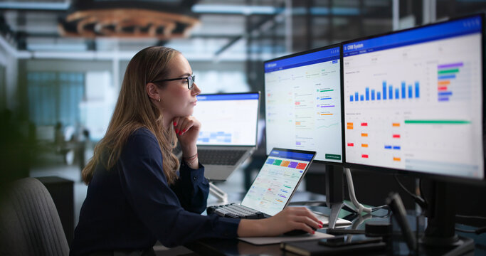 Young Sales Manager Using Laptop To Analyze Customer Data