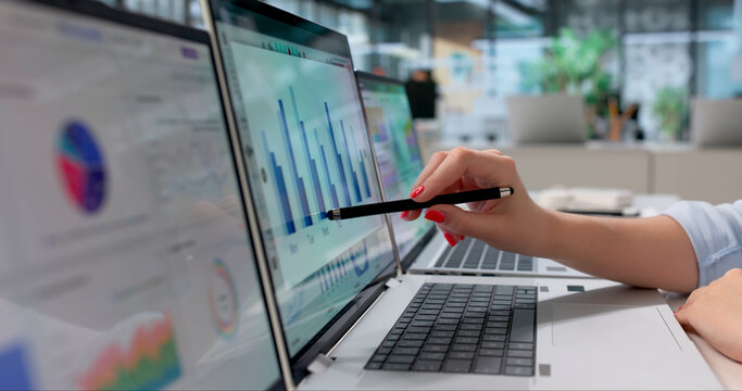 Young Female Financial Analyst Studying Performance Data