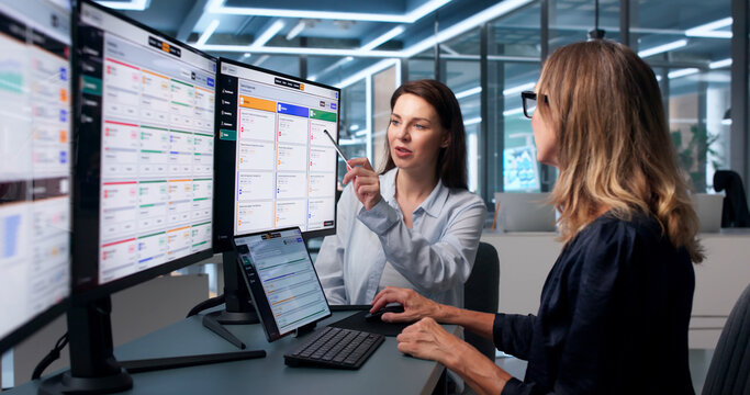 Woman Reviews Integrated Planning Data With Client