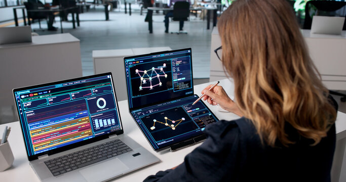 Experienced Woman Expertly Scans Security Data