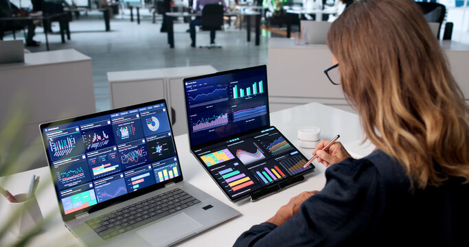 Mature Woman Analyzing Financial Data