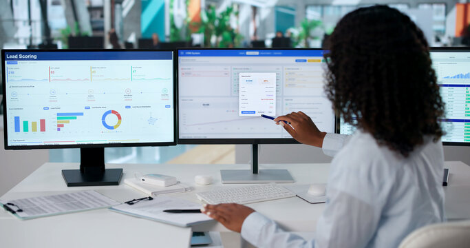 Young African American Woman Uses CRM Software