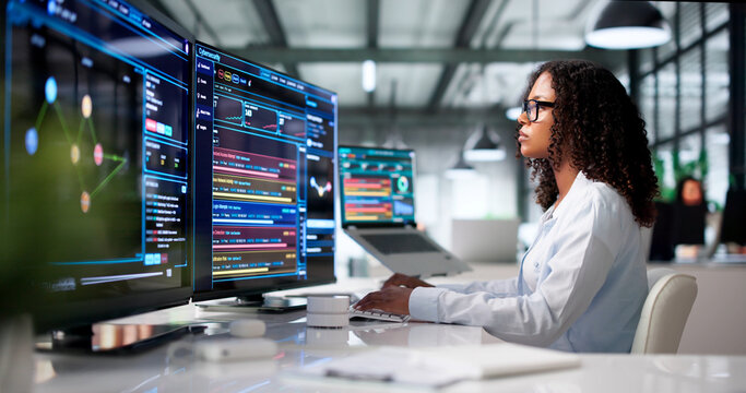 Young African Woman Uses Computer Tools To Monitor Network