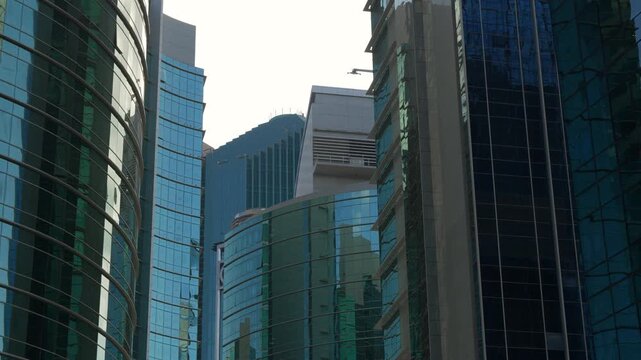 day time adu dhabi city downtown modern office skyscrapers exterior slow motion panorama 4k united arab emirates