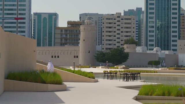 day time abu dhabi city center famous park square cafe slow motion pov panorama 4k united arab emirates