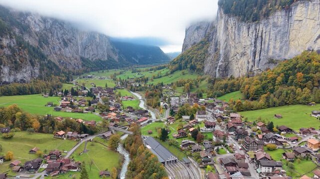 Aerial view of Lauterbrunnen alpine village and Staubbach Falls in autumn. Canton of Bern, Switzerland.