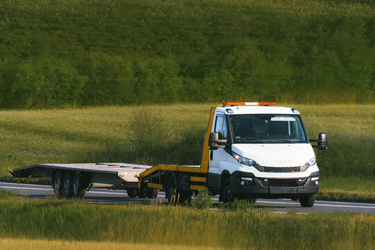 Vehicle recovery service driving in countryside