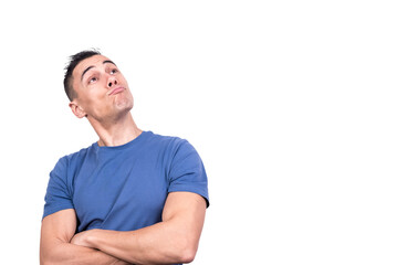 Obraz premium Man with arms folded looking up with a satisfied expression