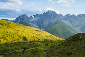 Fototapeta premium High altitude grassland and jagged mountain scenery, Sichuan, China
