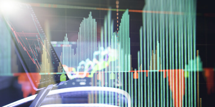 Futuristic business background with stock exchange charts and modern technology.