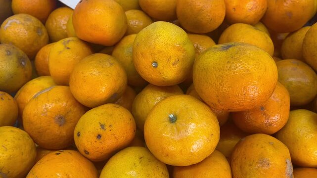 Fresh raw ripe local oranges heap close up