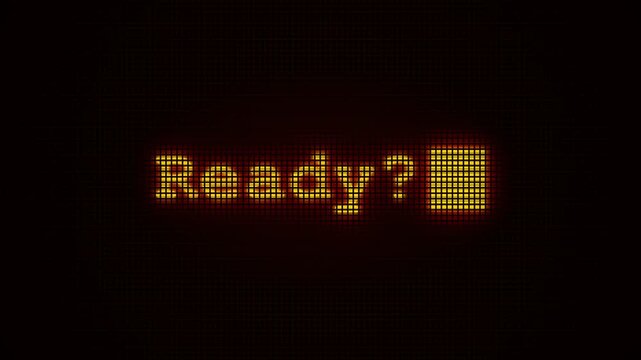 A glowing orange pixelated query displaying the word Ready appears on a dark screen mimicking retro computer interfaces from vintage arcade gaming systems that invite players to start