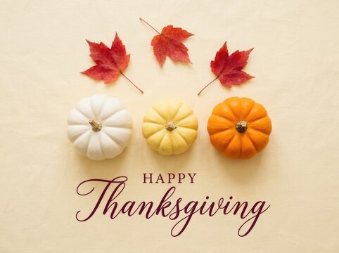 Happy thanksgiving greeting card featuring colorful pumpkins and autumn maple leaves on a light beige background