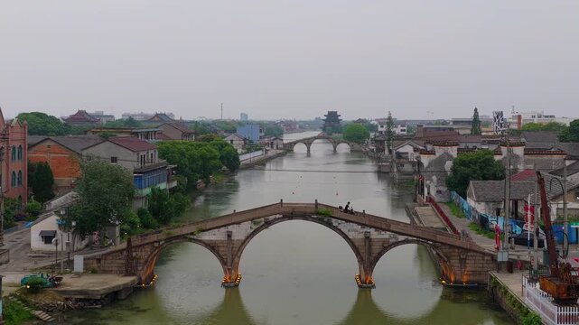 Aerial View of the three bridges in Shuanglin Town at Dusk, Huzhou, Zhejiang Province, China.