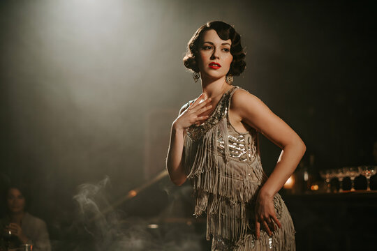 Woman in a silver sequin flapper dress posing in a smoky jazz club, vintage 1920s style, looking away with a dramatic and expression