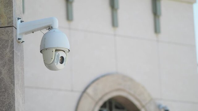 Security camera installed on building wall