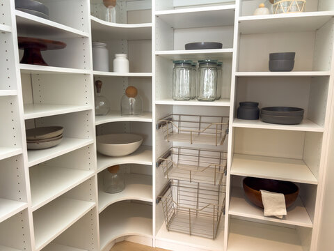 Pantry with shelves jars and kitchenware