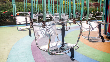 empty swing  carousels in the park © Salouw