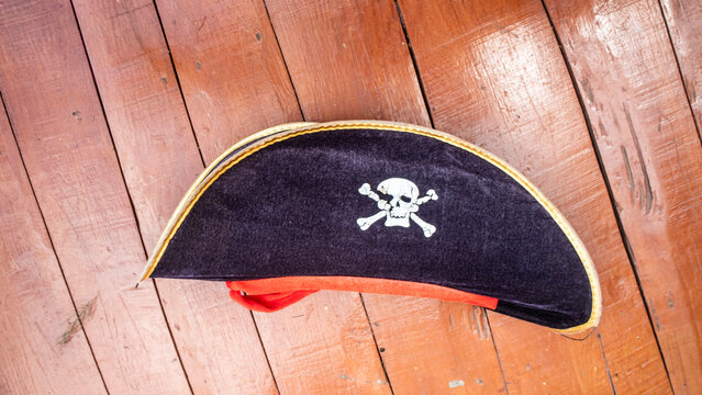  a pirate hat with wooden background